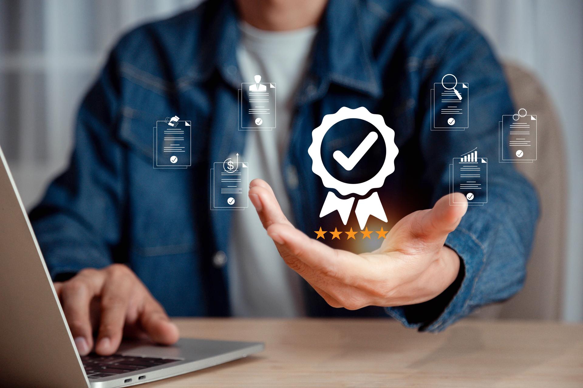 Businessman holding and showing the best quality assurance with five stars, ISO certification and standardization, Guarantee, Standards, Product and service warranty , Quality assurance concept .