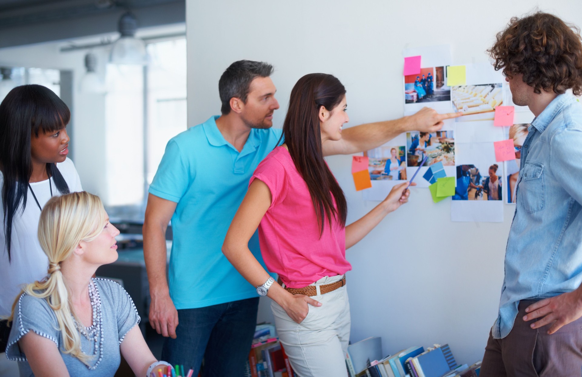 Business people, creative wall and planning, project ideas and magazine ideas, branding and teamwork. Group of women, men and mentor with moodboard notes, inspiration and goals at advertising agency